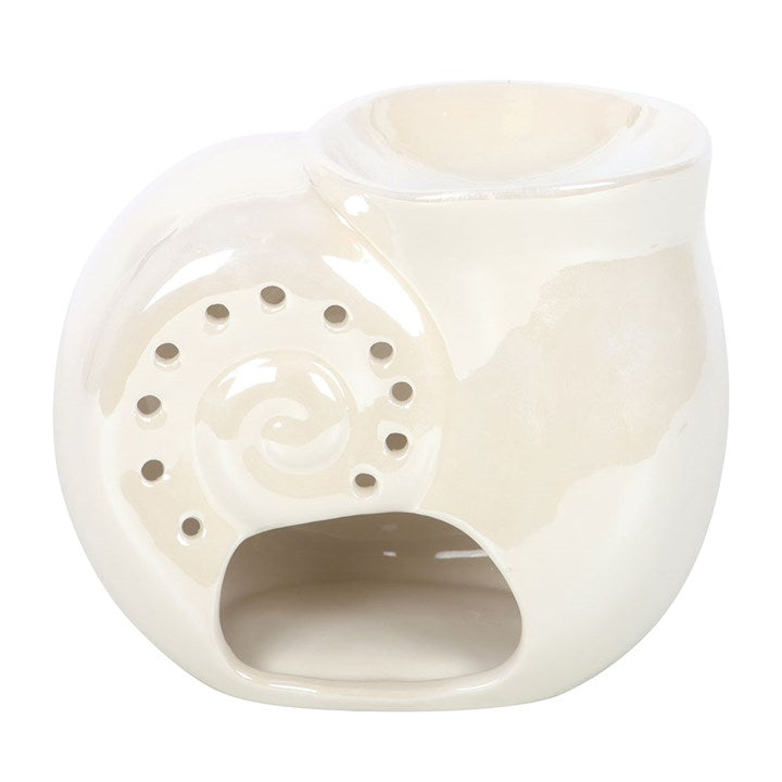 White ceramic oil burner with decorative design on a white background