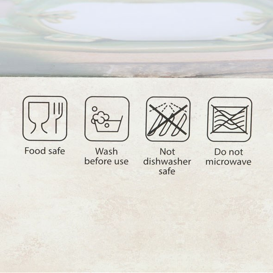 Care icons for the frog mug showing food safe, wash before use, not dishwasher safe, and do not microwave symbols.