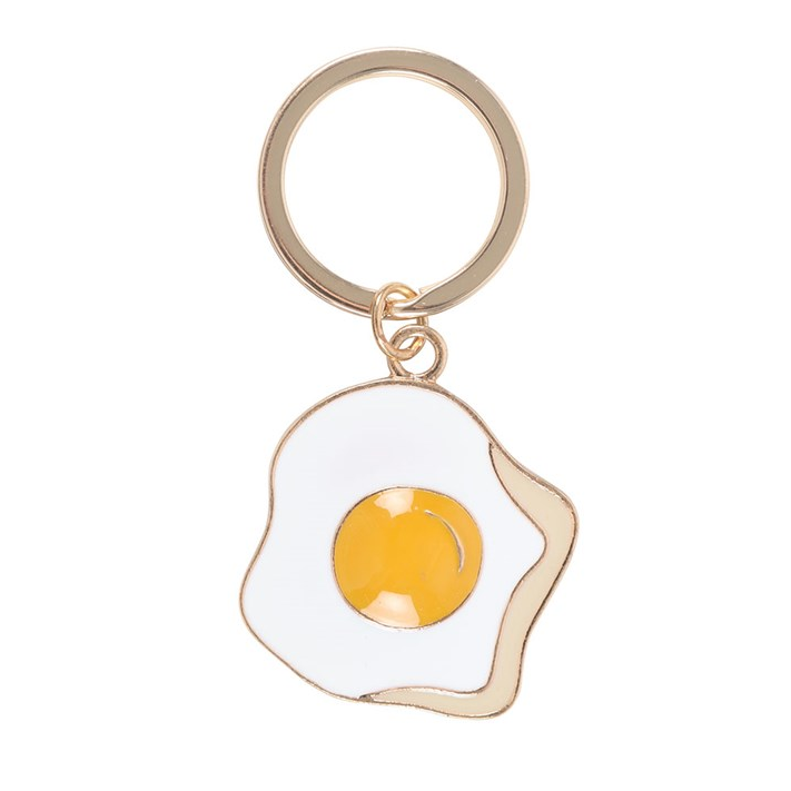 Keychain with a design of a fried egg on a white background