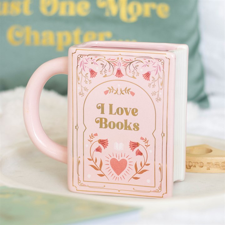 Pink mug with 'I Love Books' design on a book