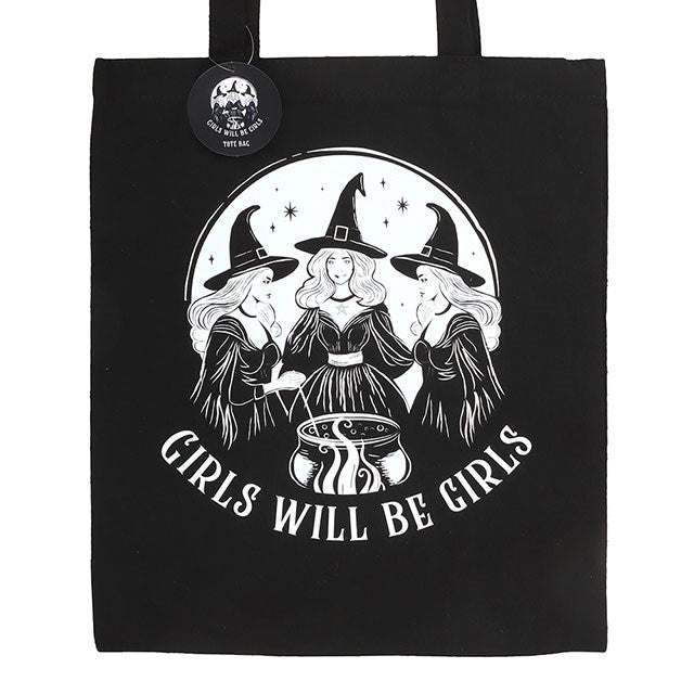 Black tote bag with white graphic of three witches and 'Girls Will Be Girls' text on a white background