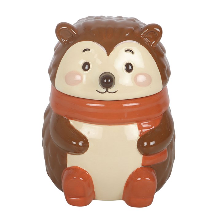 Ceramic hedgehog-shaped oil burner with a scarf on a white background.