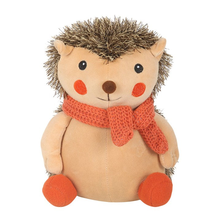 Plush hedgehog doorstop with an orange scarf.