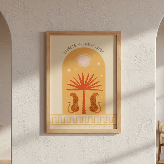 Framed artwork with a sun, palm tree & leopard design on a beige wall.