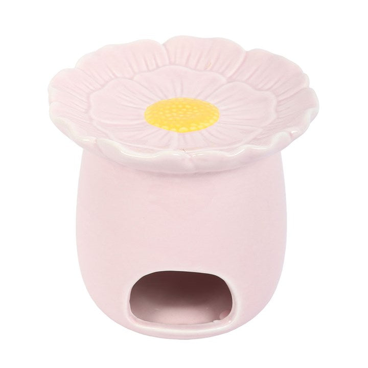 Pink flower-shaped oil burner with a yellow centre on a white background
