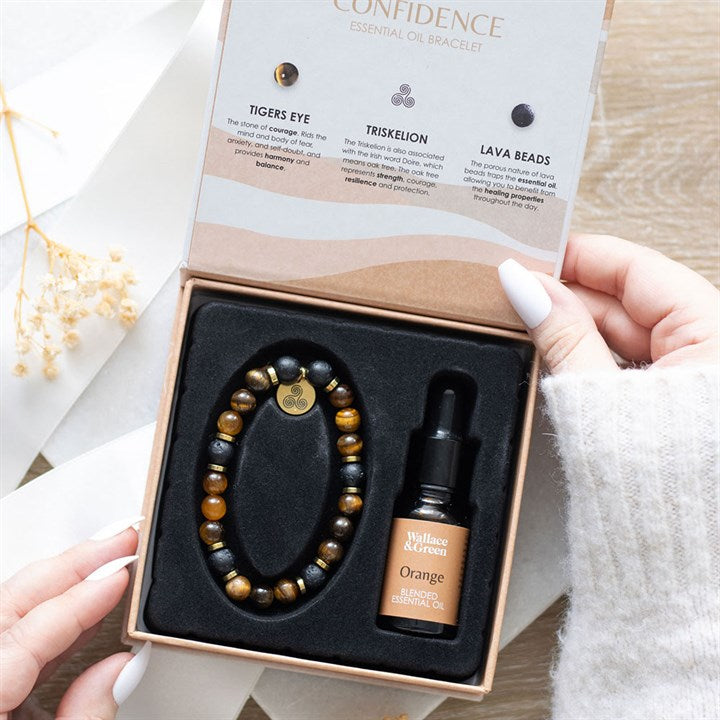 Bracelet and essential oil bottle set in a box with a card explaining ingredients.