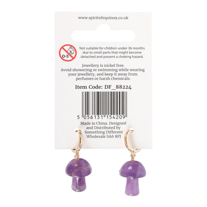 Purple mushroom-shaped earrings on a branded card with product details.