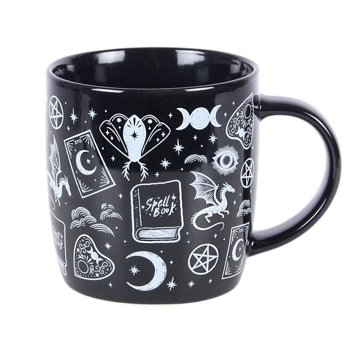 Black mug with white mystical symbols on a white background