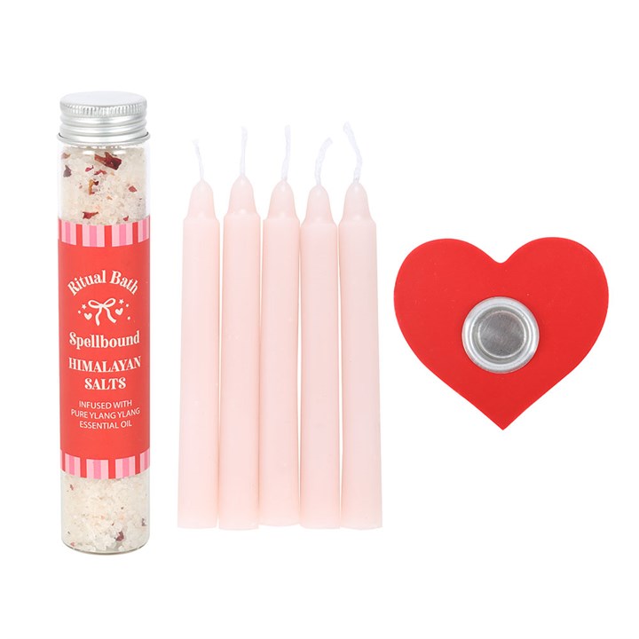 Ritual Bath Spellbound Himalayan Salts packaging with pink candles and a red heart-shaped item on a white background