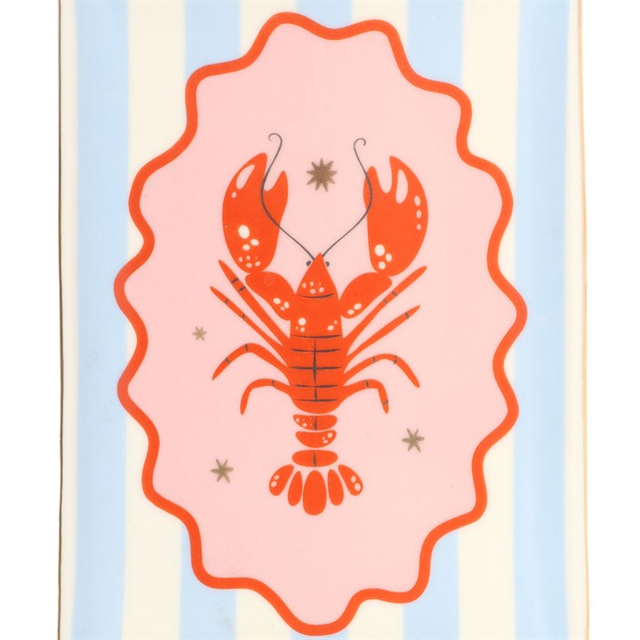 Trinket dish featuring a red lobster illustration with a striped background