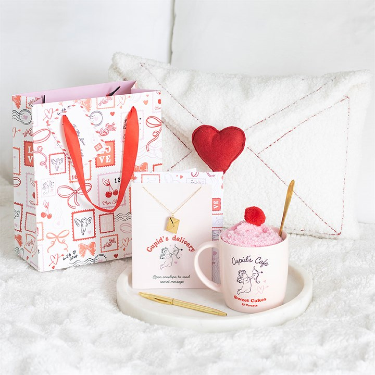 Cupcake-themed mug, gift bag, and cushion