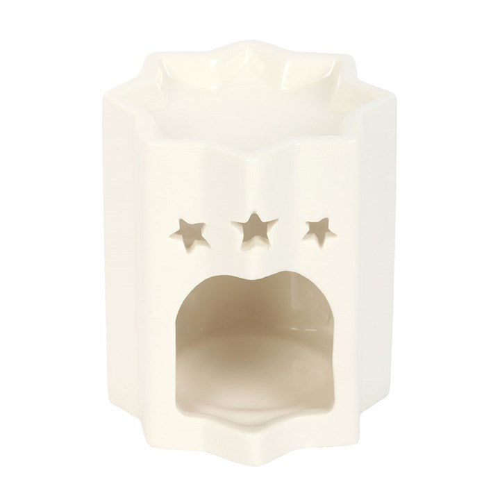 Decorative oil burner with star cutouts on a white background