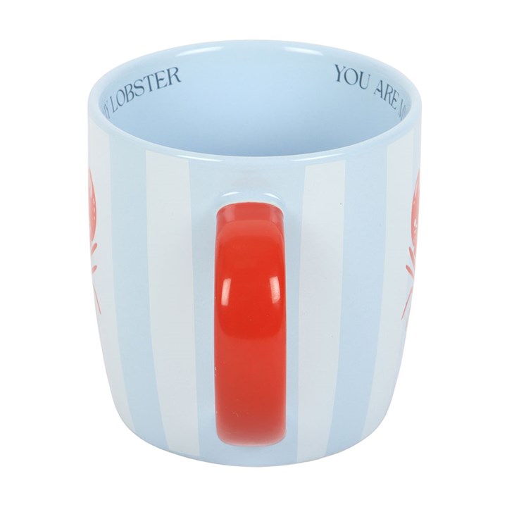 Mug with red handle and text on light blue 